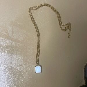 gold and white stone necklace